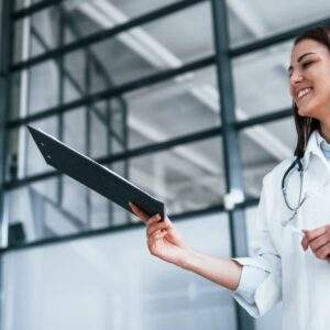 Young nurse indoors in modern clinic. Conception of healthcare