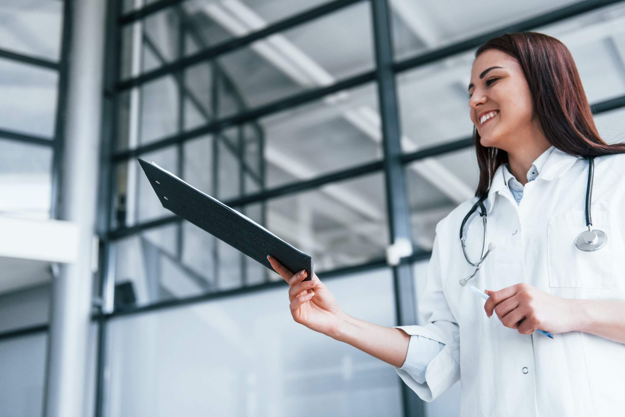 Young nurse indoors in modern clinic. Conception of healthcare