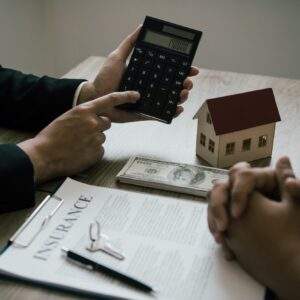 Agents are calculating the loan payment rate or the amount of insurance premiums for customers